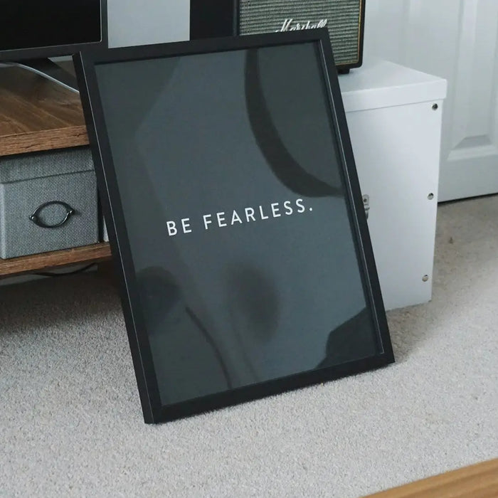 Framed motivational print with BE FEARLESS text on dark background for custom framing ideas.