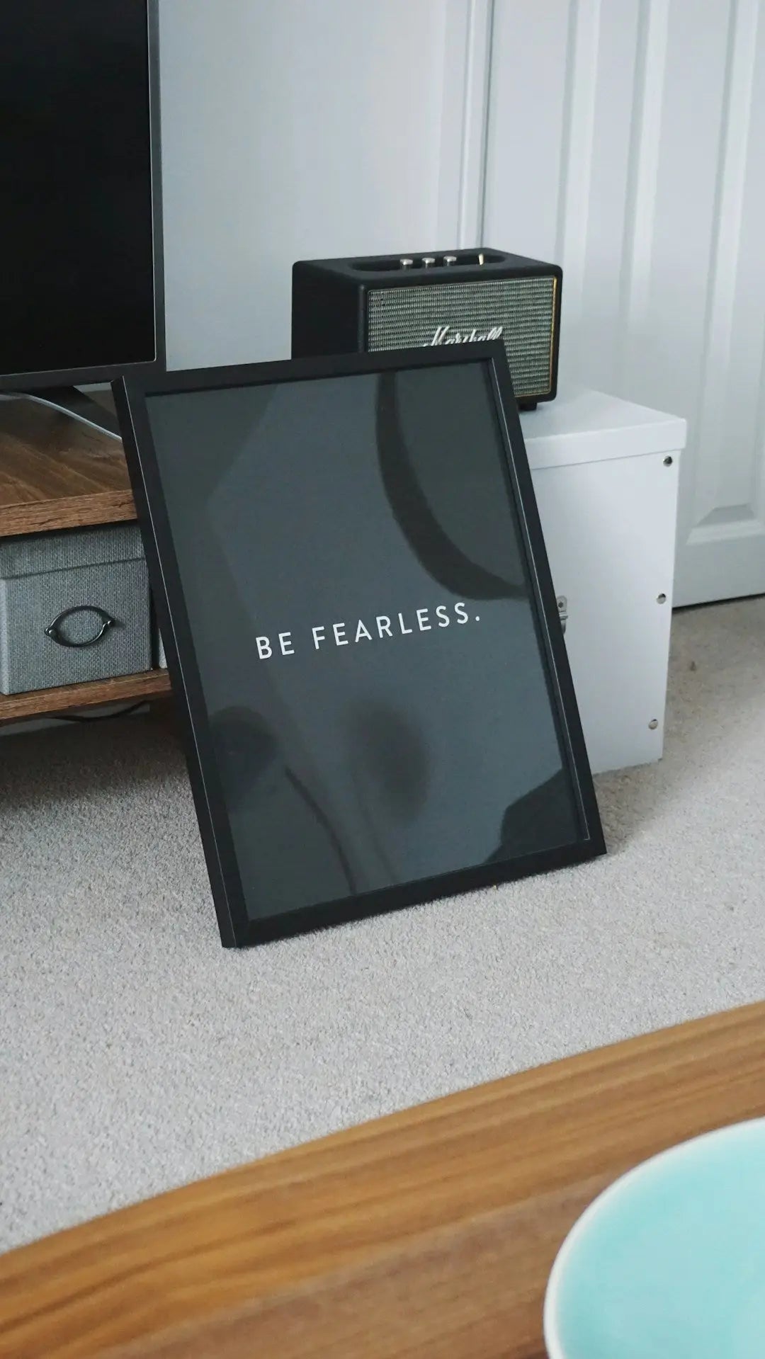 Framed BE FEARLESS print showcasing modern memory design on dark background.