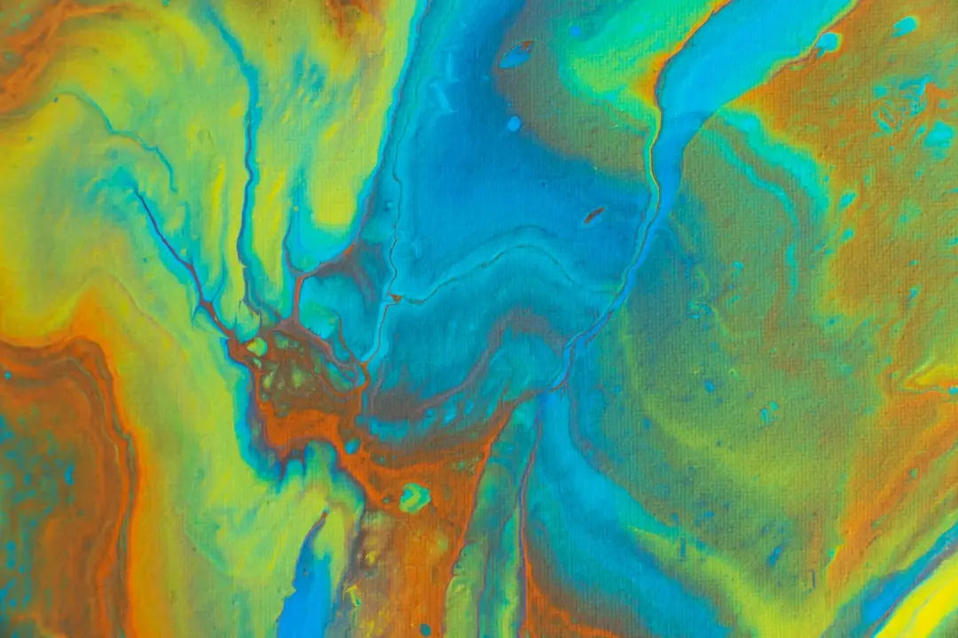 Abstract fluid painting in blue, green, and orange for stunning wall art inspiration.