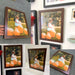 Collection of framed photographs in a 42x46 picture frame featuring person with pumpkins