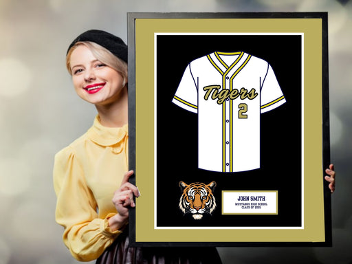 a woman holding up a framed baseball jersey